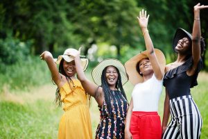 Group of four gorgeous african american womans wear summer hat s