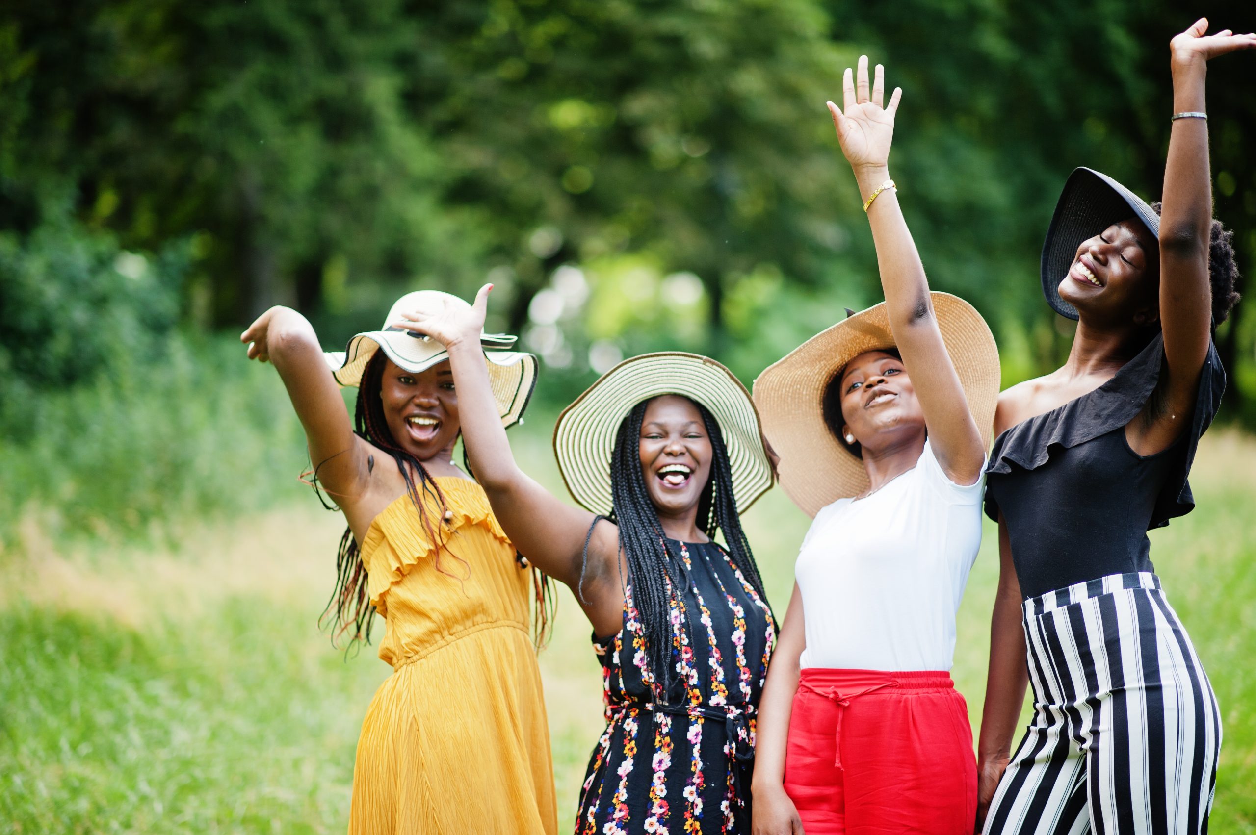 Group of four gorgeous african american womans wear summer hat s