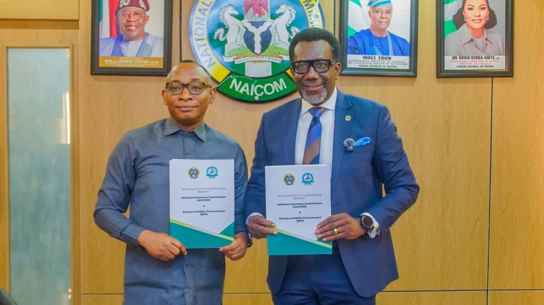 Director-General of the Bureau of Public Procurement, Dr Adebowale Adedokun (left) and Commissioner for Insurance/CEO, NAICOM, Olusegun Ayo Omosehin, after both agencies signed a Memorandum of Understanding (MoU) to enhance collaboration and strengthen the insurance industry, particularly in relation to public procurement processes.
