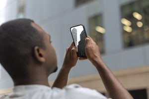 person-reading-cell-phone-messages