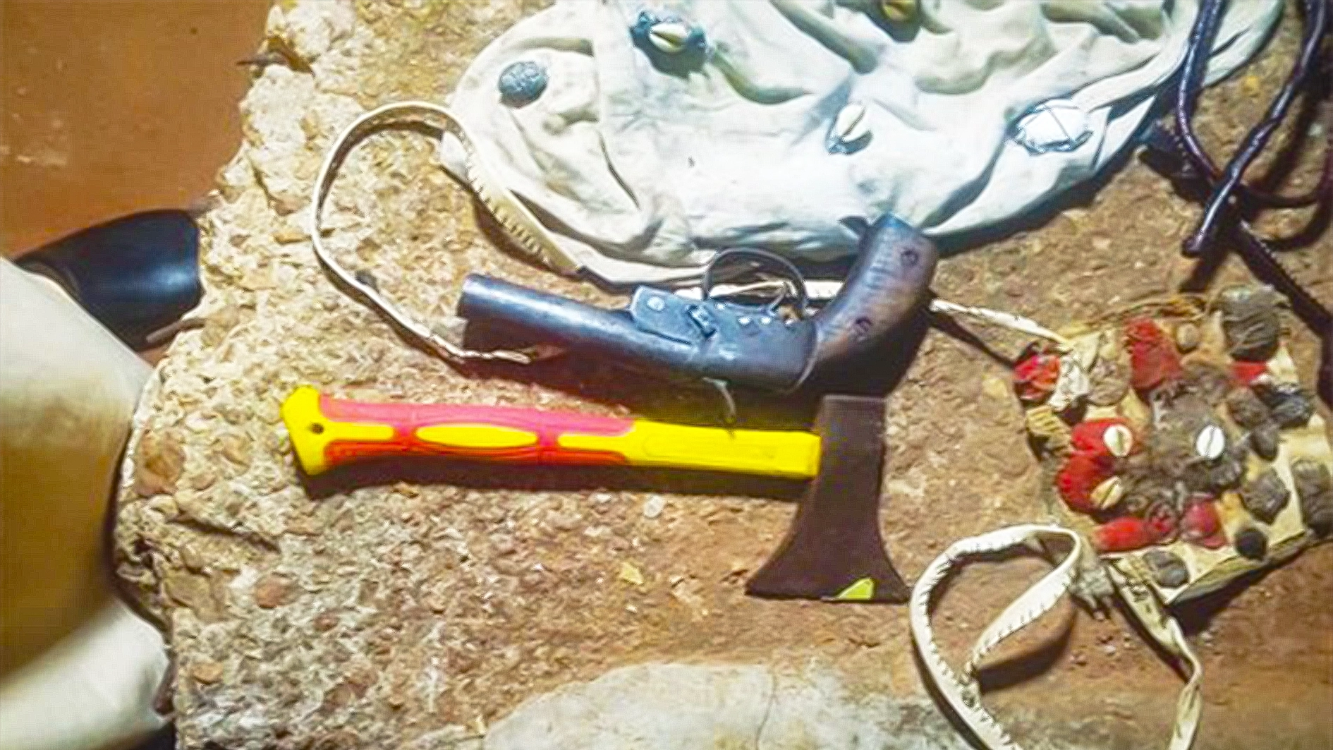 pistol, an axe, suspected charms and the stolen phone