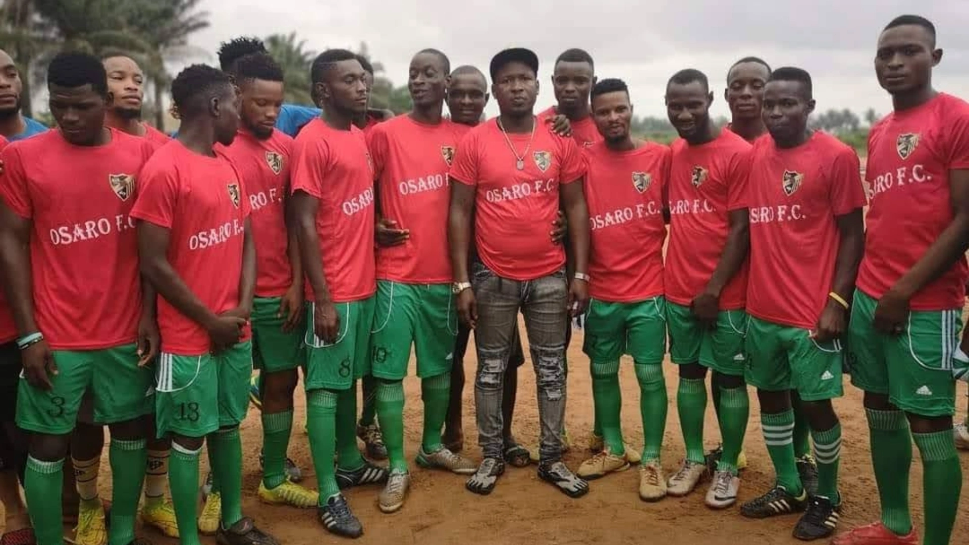 Lucky Osaro Godwin, founder of Osaro International Sports Academy, and some OISA players