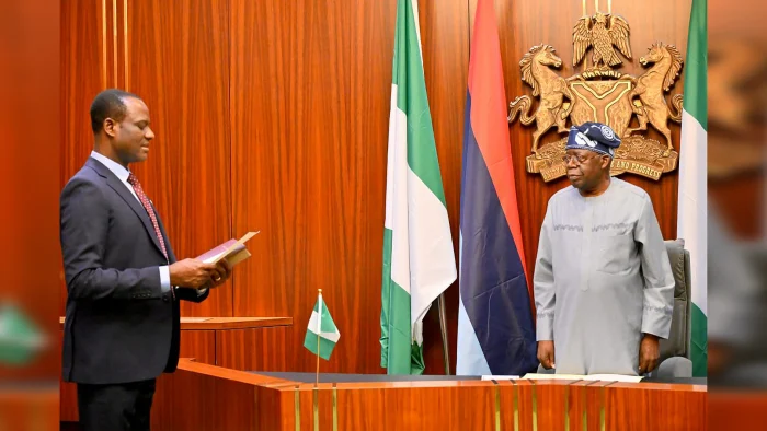 President Bola Tinubu administers the oath of office on Mr Taiwo Oyedele as the new Minister of State for Finance