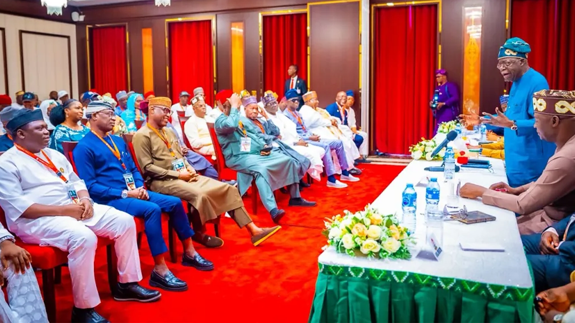 President Bola Tinubu (standing) addressing leaders and members of the RHA during the visit.