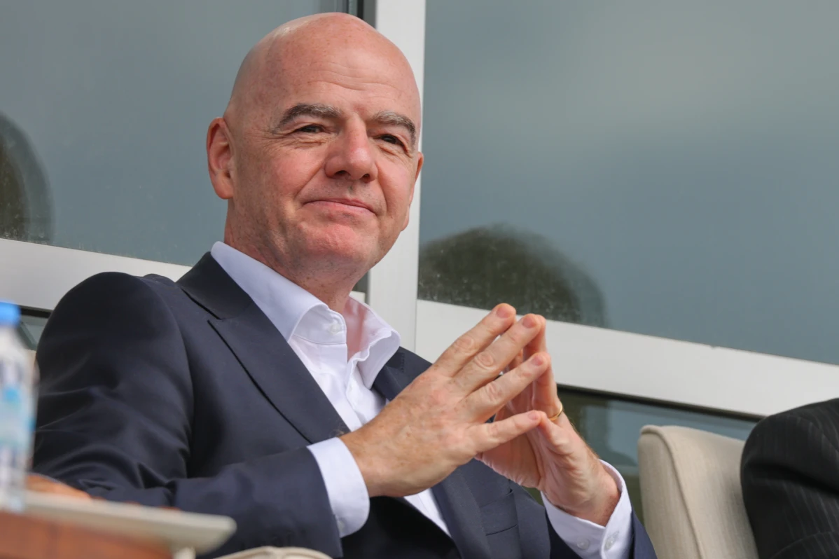 FIFA president Gianni Infantino confirms Iran will play at 2026 World Cup, urging separation of football from geopolitical tensions.