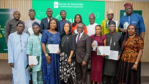 Back row: Chief Financial Officer, Bank of Industry (BOI), Taiwo Kolawole (left); flanked by Business Development Service Providers (BDSPs) and Divisional Head, Business Development and Partnerships, BOI, Obaro Osah (3rd right).Front row:Company Secretary, BOI, Olufunlola Salami (4th left); followed by Chief Strategy and Development Officer, BOI, Dr Isa Omagu (5th left) and Director-General of the Lagos Chamber of Commerce and Industry (LCCI), Dr Chinyere Almona (right), as well as other 2025 top performing BDSPs of BOI at an award ceremony in Lagos.