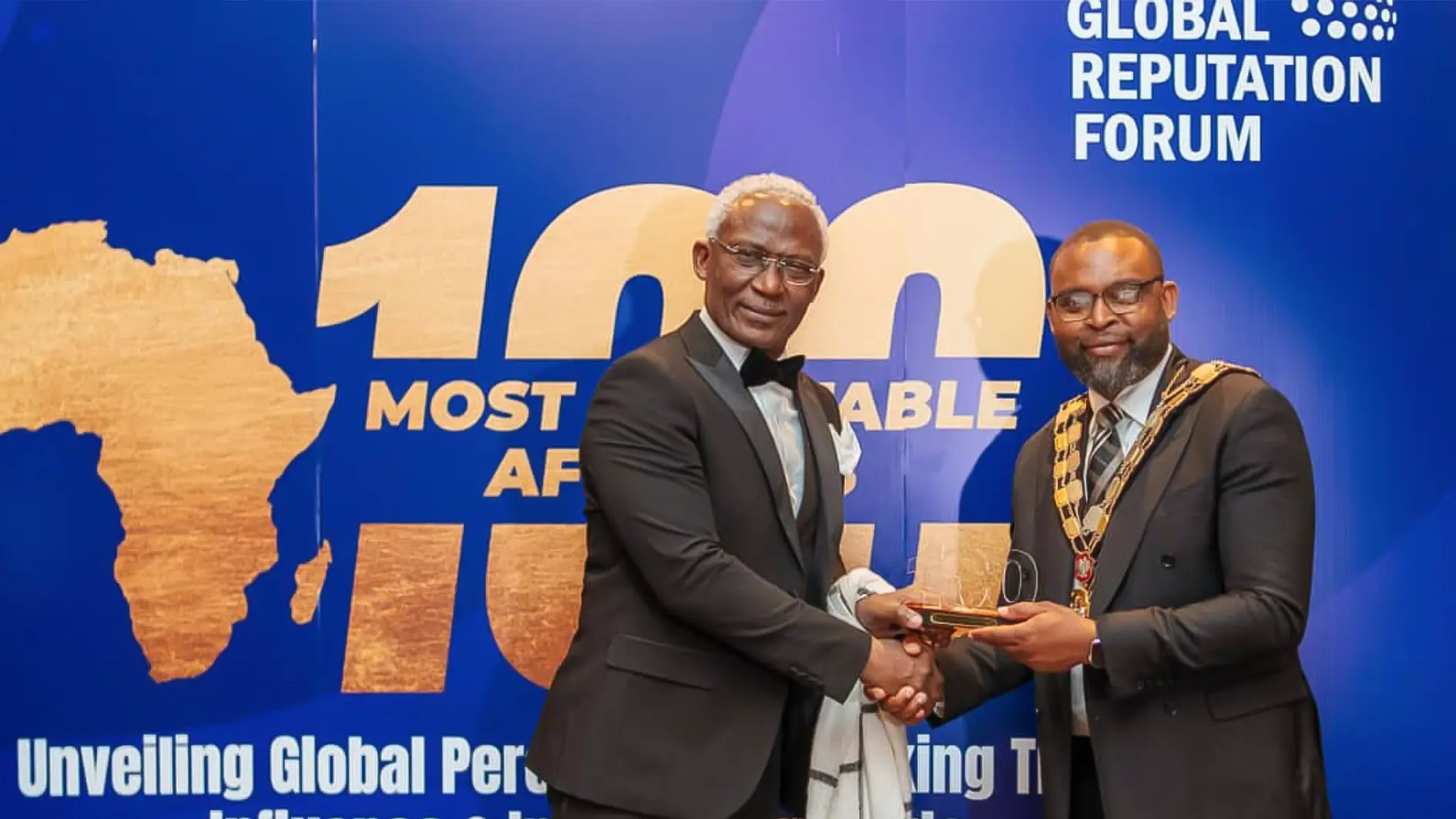 Managing Director and Editor-in-Chief of News Central Kayode Akintemi receiving the award for 100 Most Reputable Africans from Councillor Jason Jackson, Mayor of LB Islington, London UK.