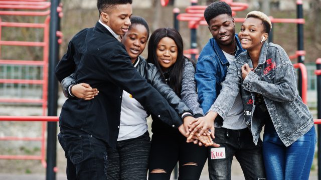 Young millennials african friends on outdoor gym. Happy black pe