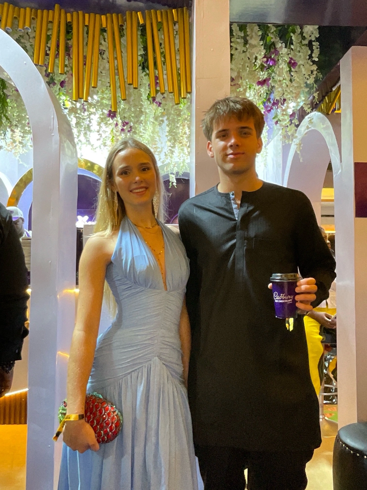 Attendees at the 2026 AMVCA with a cup of Cadbury Hot Chocolate drink