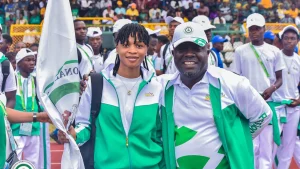 Director General of National Sports Commission (NSC), Bukola Olopade with one of the IJA athletes at the MKO Abiola Sports Complex, Abeokuta