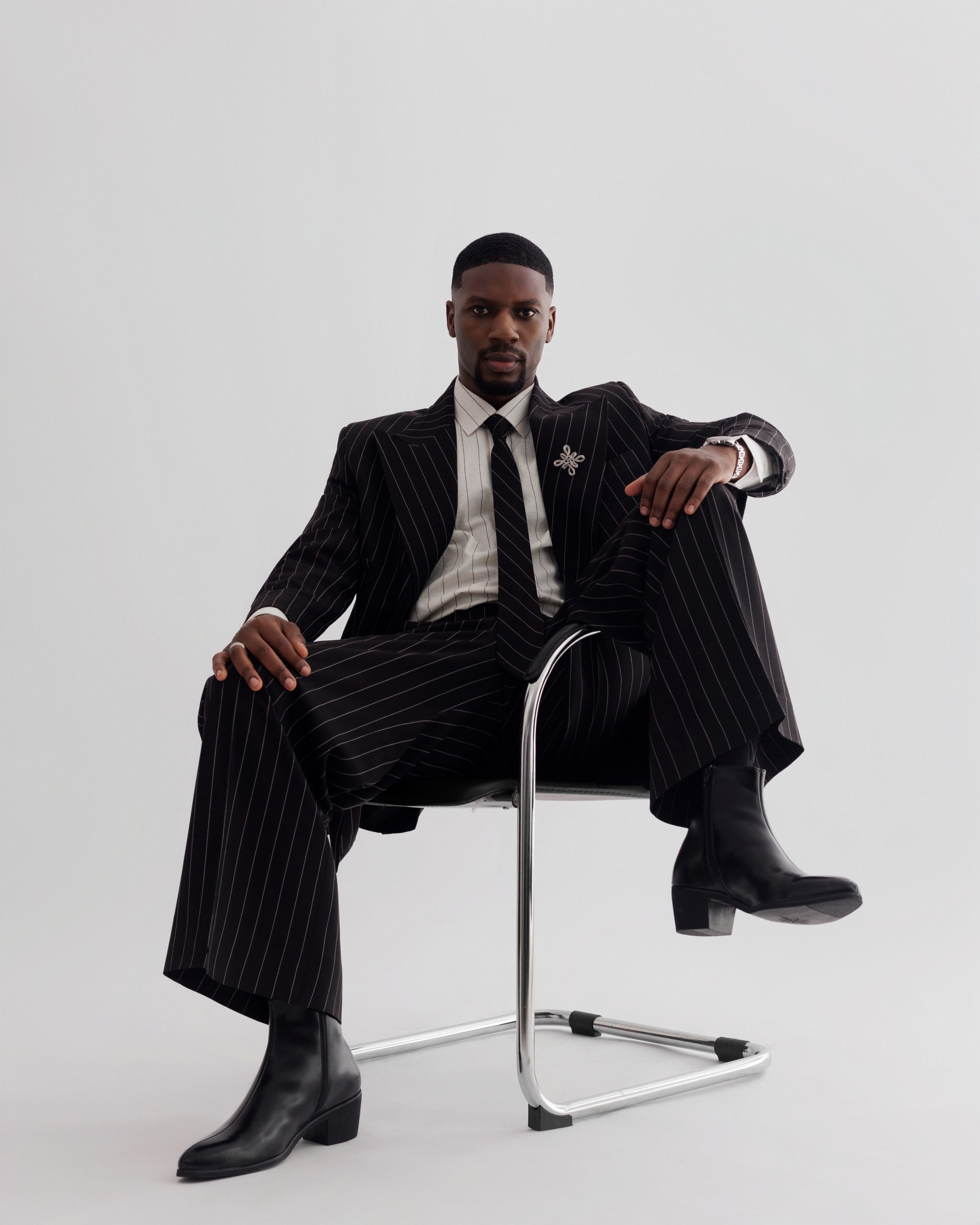Qudus Ibrahim, founder of QIB Productions, in a portrait that reflects the confidence and vision behind his growing theatre brand. Photo: Andre Oyakhilome.