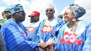President Bola Tinubu gives a handshake to Imaan Sulaiman-Ibrahim