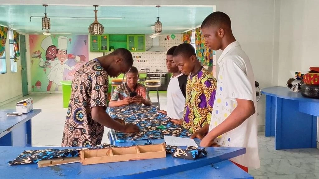 Youths Learning Tailoring during the Child Domestic Workers' Skill Acquisition Training