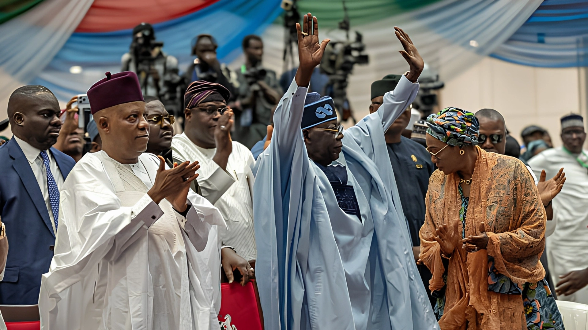 Nigeria's Vice President Kashim Shettima (L) congratulates Nigeria's President Bola Ahmed Tinubu (C) after his victory of the All Progressive Congress (APC) party's presidential primary election at the Bola Ahmed Tinubu International Conference Centre on May 24, 2026. (Photo by Light Oriye Tamunotonye / AFP via Getty Images)