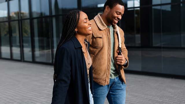 Young couple smiling and walking together. Photo Magnific