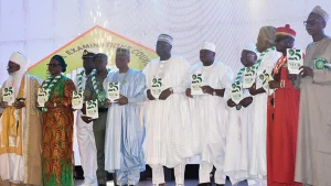 Dignitaries at NECO’s 25th anniversary displaying copies of the book, ‘Twenty-Five Years of NECO: Evolution, Challenges and Contributions to Nigeria’s Educational Assessment System’
