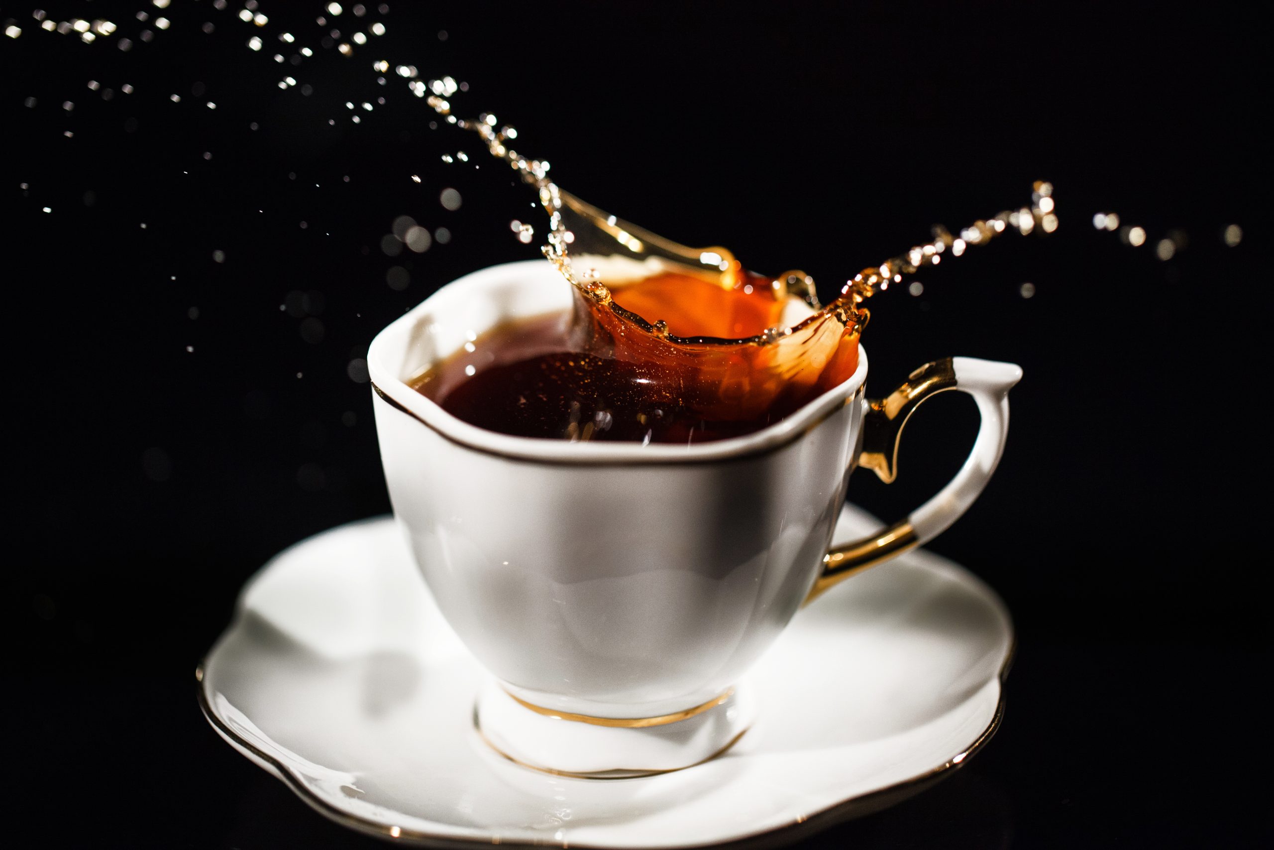 A warm cup of black tea served in a ceramic mug, known for its calming properties, soothing aroma, and potential wellness benefits.
