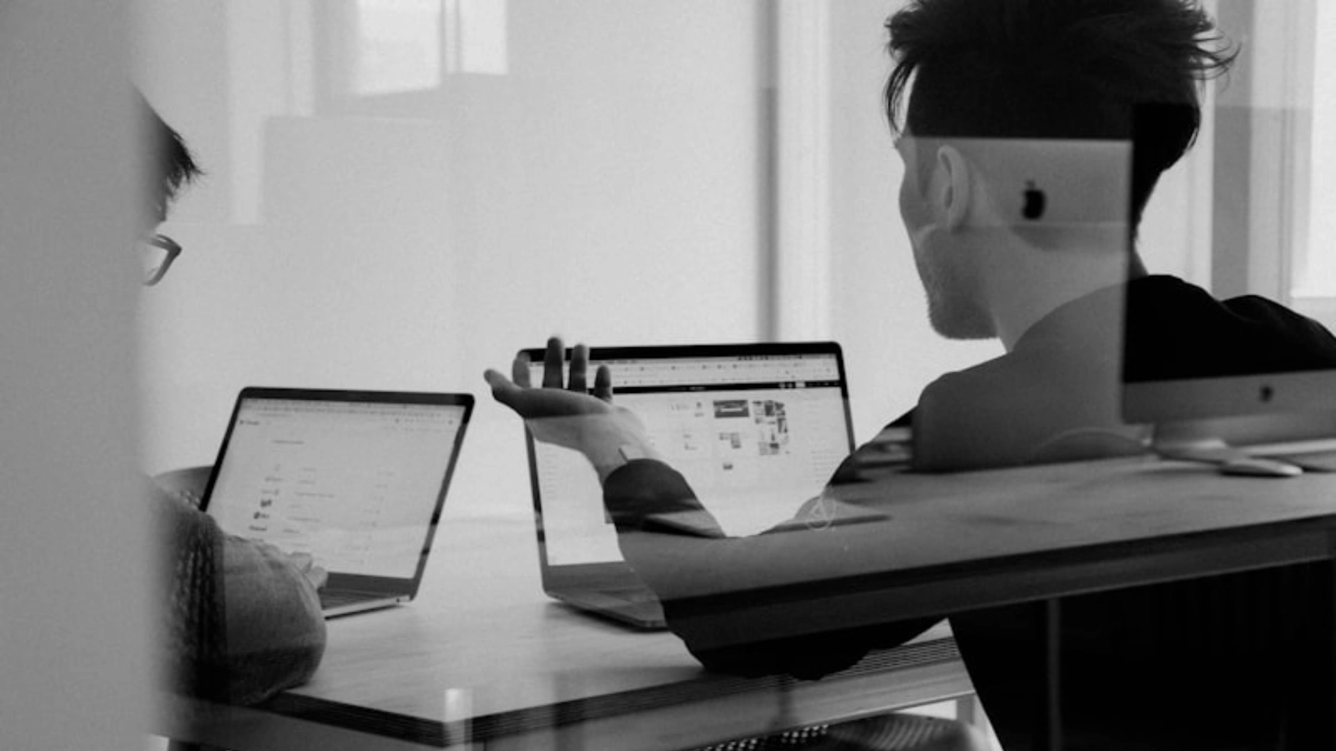 Business owners behind a glass corridor