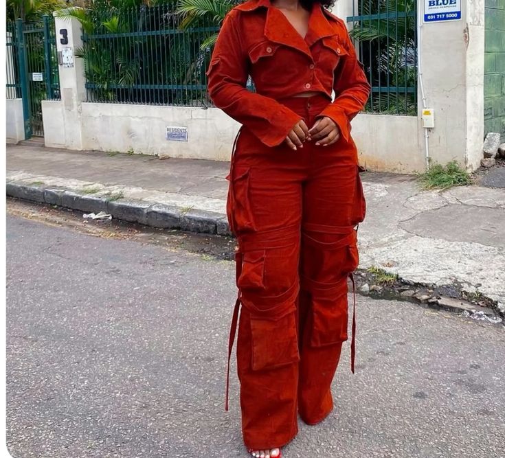 Fashionable cargo pants with multiple utility pockets, worn casually for a trendy streetwear look.