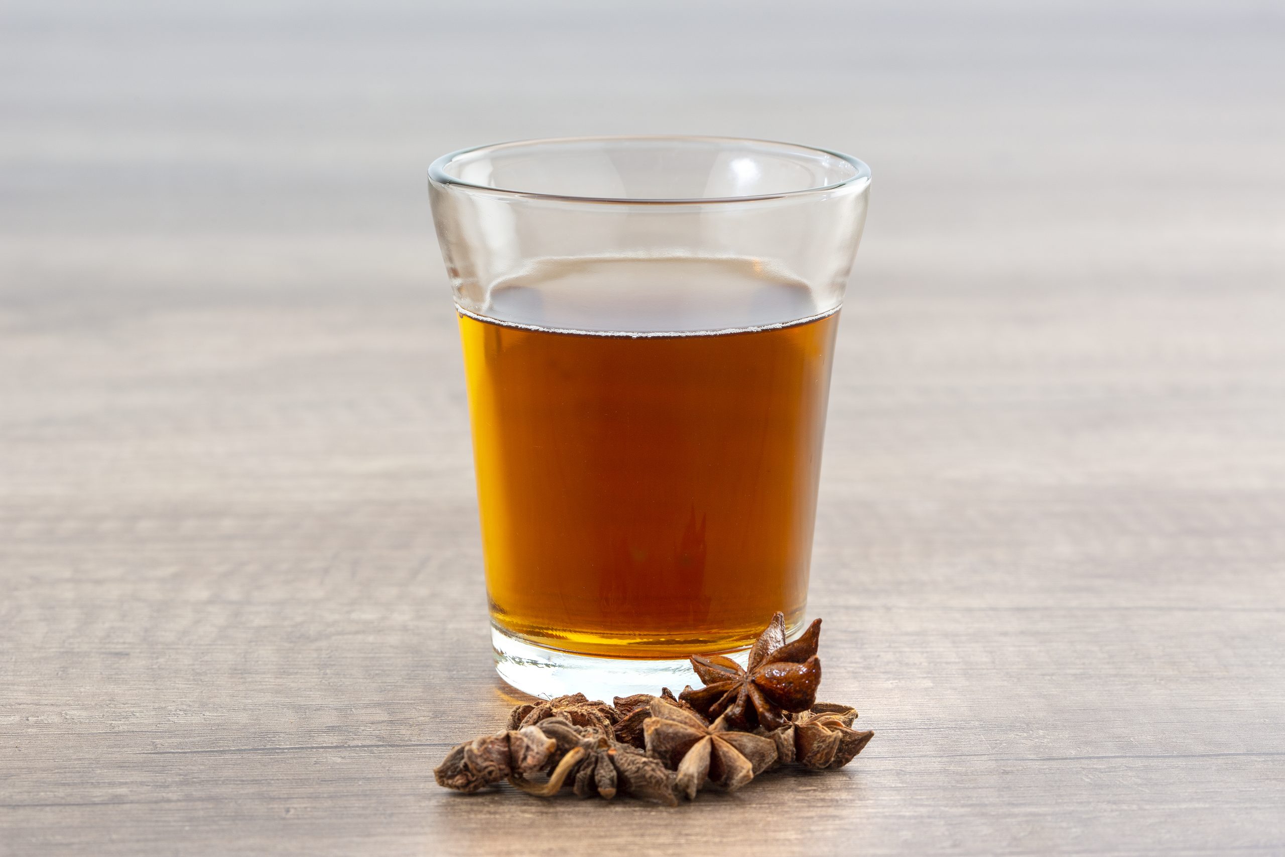 Glass cup of ginger tea