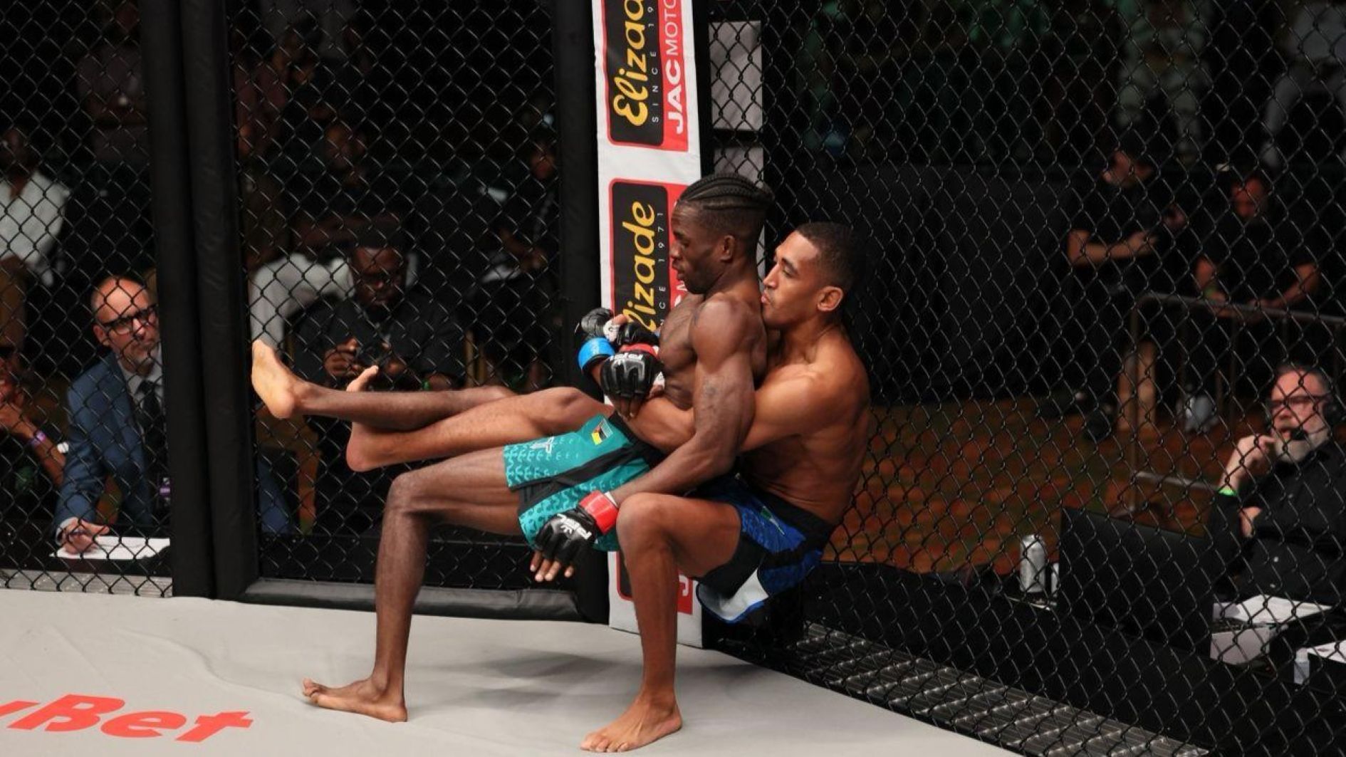 Raphael Uchegbu (left) grappling with Edson Machavane during their PFL Africa bantamweight fight in Lagos at the weekend.