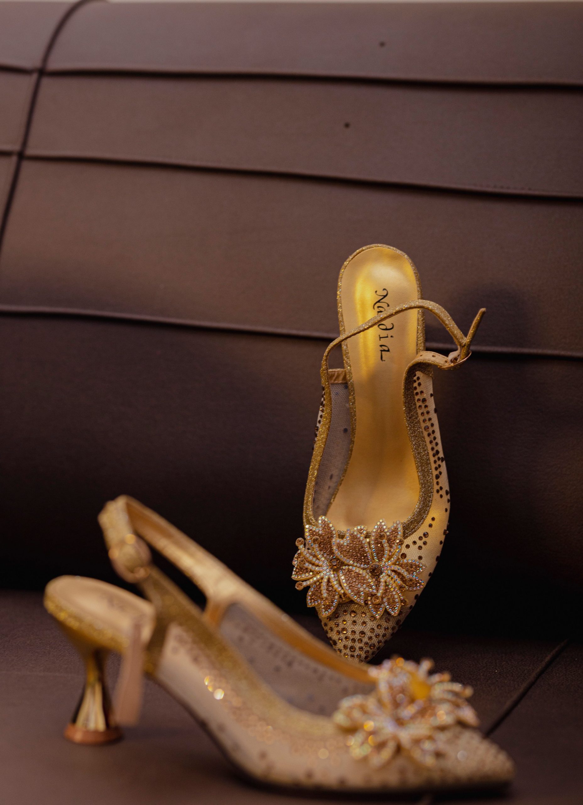 Gold crystal slingback heels with 3D beaded floral embellishment and sculptural stiletto heel
