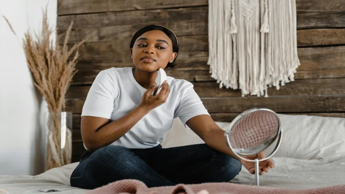 A young lady taking care of her skin