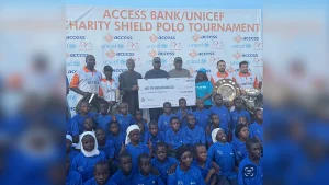 Access Bank’s Managing Director/Chief Executive Officer, Roosevelt Ogbonna (left); Minister of Defence, General Christopher Musa; Fifth Chukker Polo & Country Resort’s Adamu Atta; representative of UNICEF; winners of the 2026 Charity Shield and school children at the Charity Shield tournament’s cheque presentation ceremony in Kaduna on Sunday.