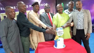 Senior Pastor, Foursquare Gospel Church, Ajao Estate, Rev’d Igbafe Edwin (middle) flanked by his right, Pastor Omotola Bantale and his left, the preacher, Brother Ademola Idowu with other elders and fathers, cutting the cake to mark Father’s Day celebration at  the Foursquare Gospel Church, Ajao Estate, Lagos… last Sunday