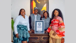 CEO/ Co-Founder, Ruby Agwu (left); Co-Founder, Olusola Ogundare; Co-Founder,  Lanre Ogundare and Executive Director, Olabukola Olajuwon showcasing the official Guinness World Records™ certificate awarded to Ajoyo NG Integrated Services Limited for achieving the most photos of people wearing Adire patterned clothing uploaded to Instagram in one hour (652 photos) in Lagos, Nigeria.
