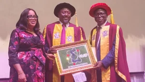 Wife of the inductee, Mrs Sylvia Nwakwue (left); Former Chairman, Society of Petroleum Engineers (SPE) Nigeria and inductee of the Nigerian Academy of Engineering (NAE), Joseph Nwakwue and immediate past President of NAE, Prof. Rahamon Bello at the investiture and induction of new fellows of the academy in Lagos.