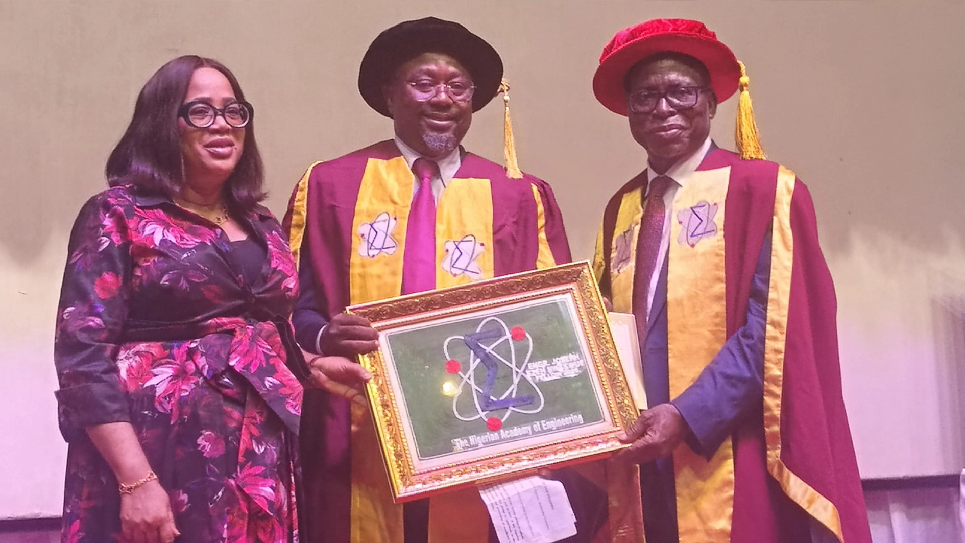 Wife of the inductee, Mrs Sylvia Nwakwue (left); Former Chairman, Society of Petroleum Engineers (SPE) Nigeria and inductee of the Nigerian Academy of Engineering (NAE), Joseph Nwakwue and immediate past President of NAE, Prof. Rahamon Bello at the investiture and induction of new fellows of the academy in Lagos.