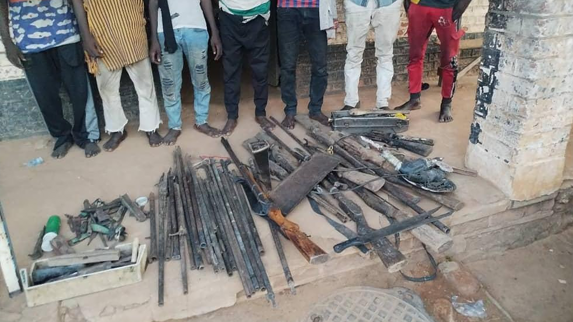 Suspects with recovered weapons