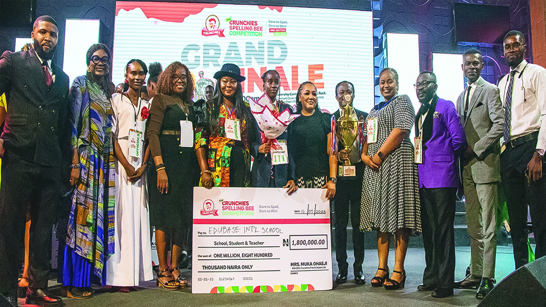 Winner, Crunchies Spelling Bee Competition (TCSBC), Grace Ihunanyachi Ogechukwu (middle); Managing Director, Crunchies Fried Chicken, Muka Ohaeji; with executives, judges, and school representatives at the Spelling Bee Competition in Aba, recently.
