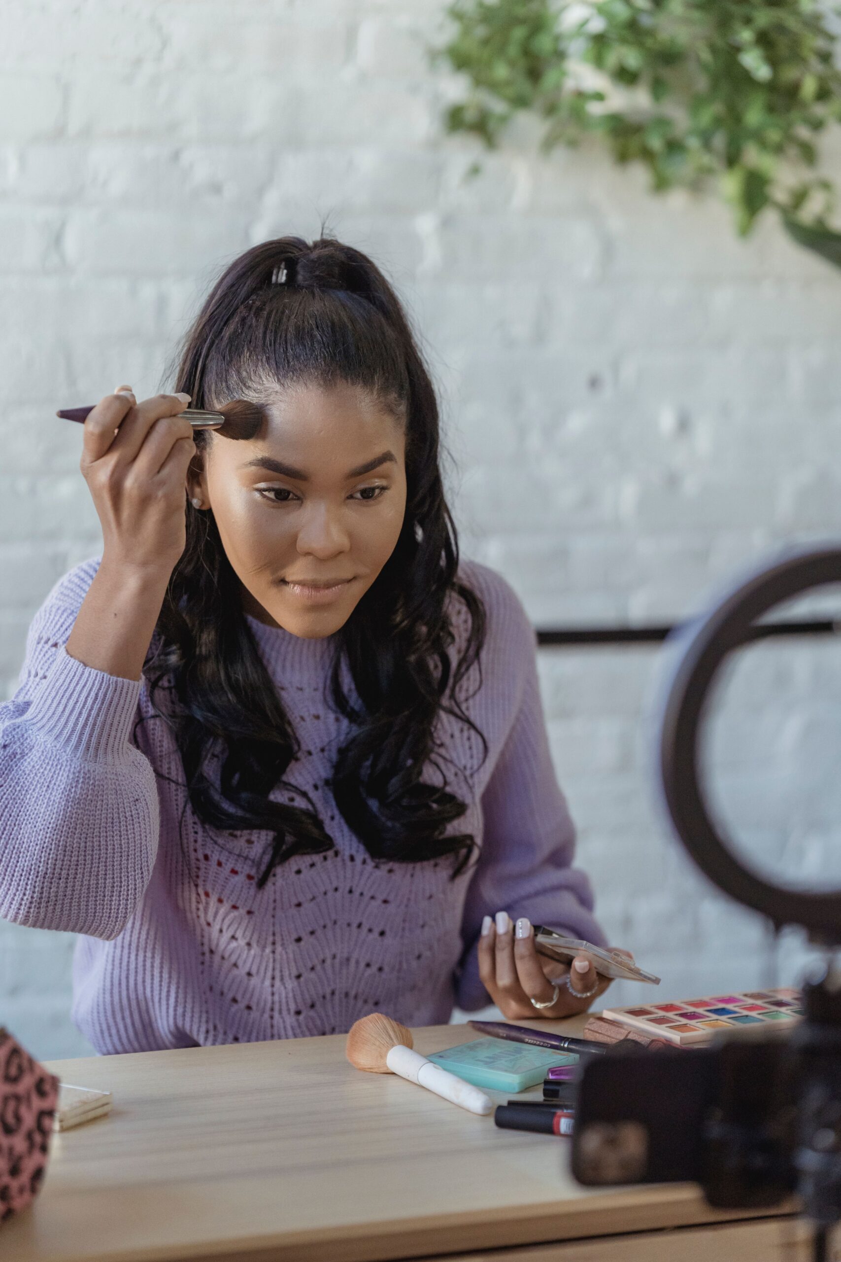 Applying heavy makeup