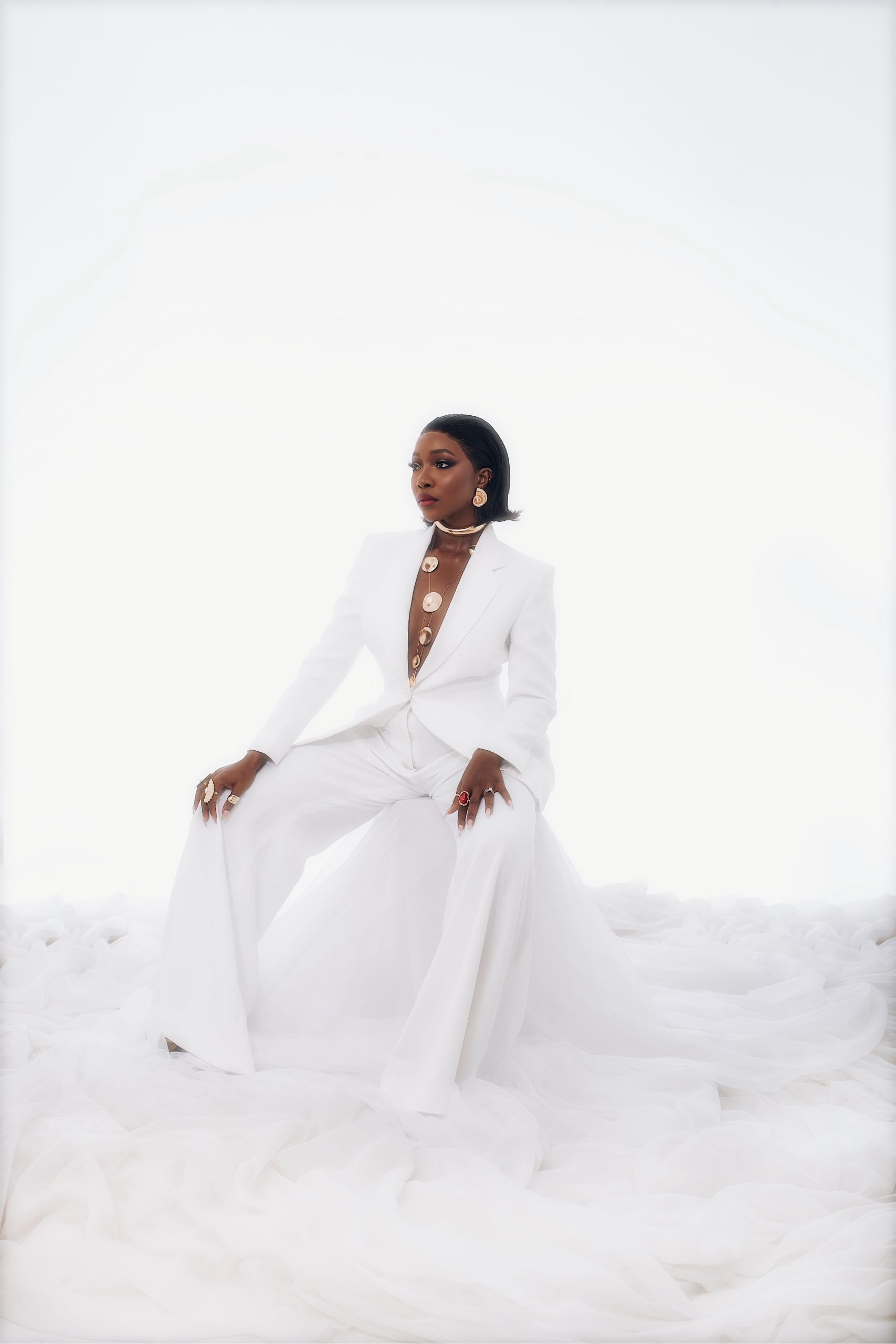 Nigerian actress Ini Dima-Okojie wearing a chic, elegant outfit while posing confidently for a fashion portrait.