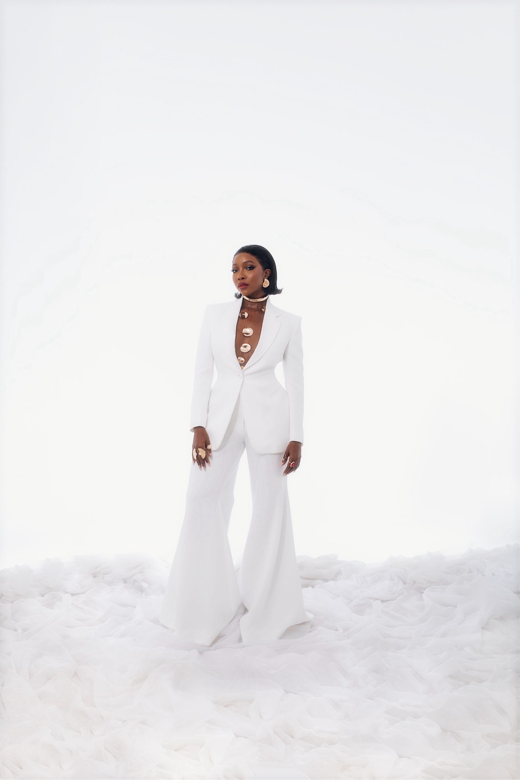 Nigerian actress Ini Dima-Okojie wearing a chic, elegant outfit while posing confidently for a fashion portrait.