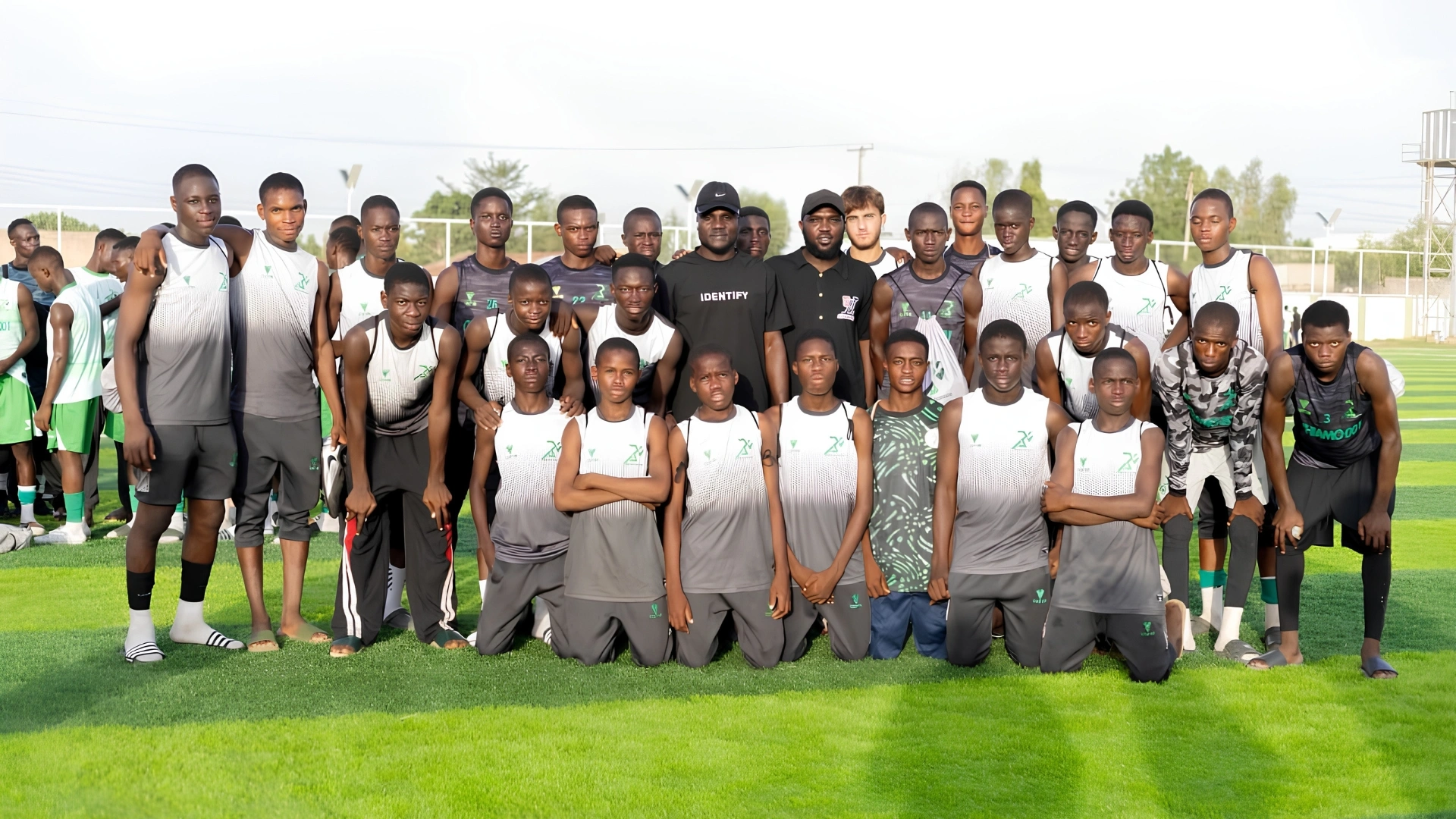 Jeremiah Ogaga with players and officials of Breakthrough Football Academy during his visit