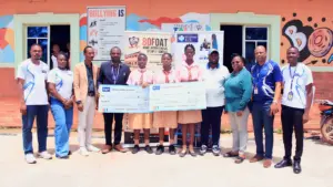 Keystone Bank officials presenting awards to outstanding students at an event