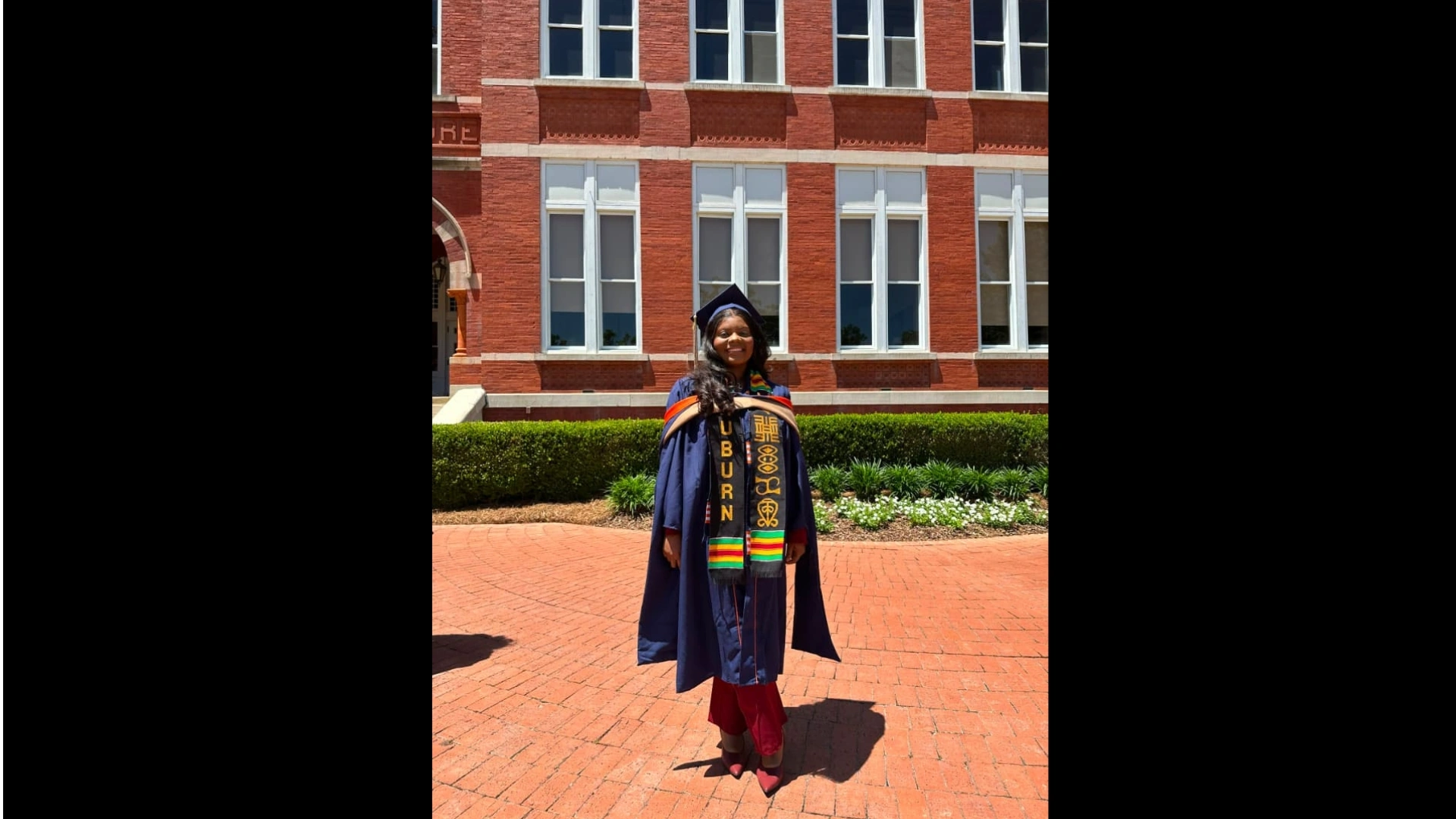 A woman in a graduation gown ay Auburn University
