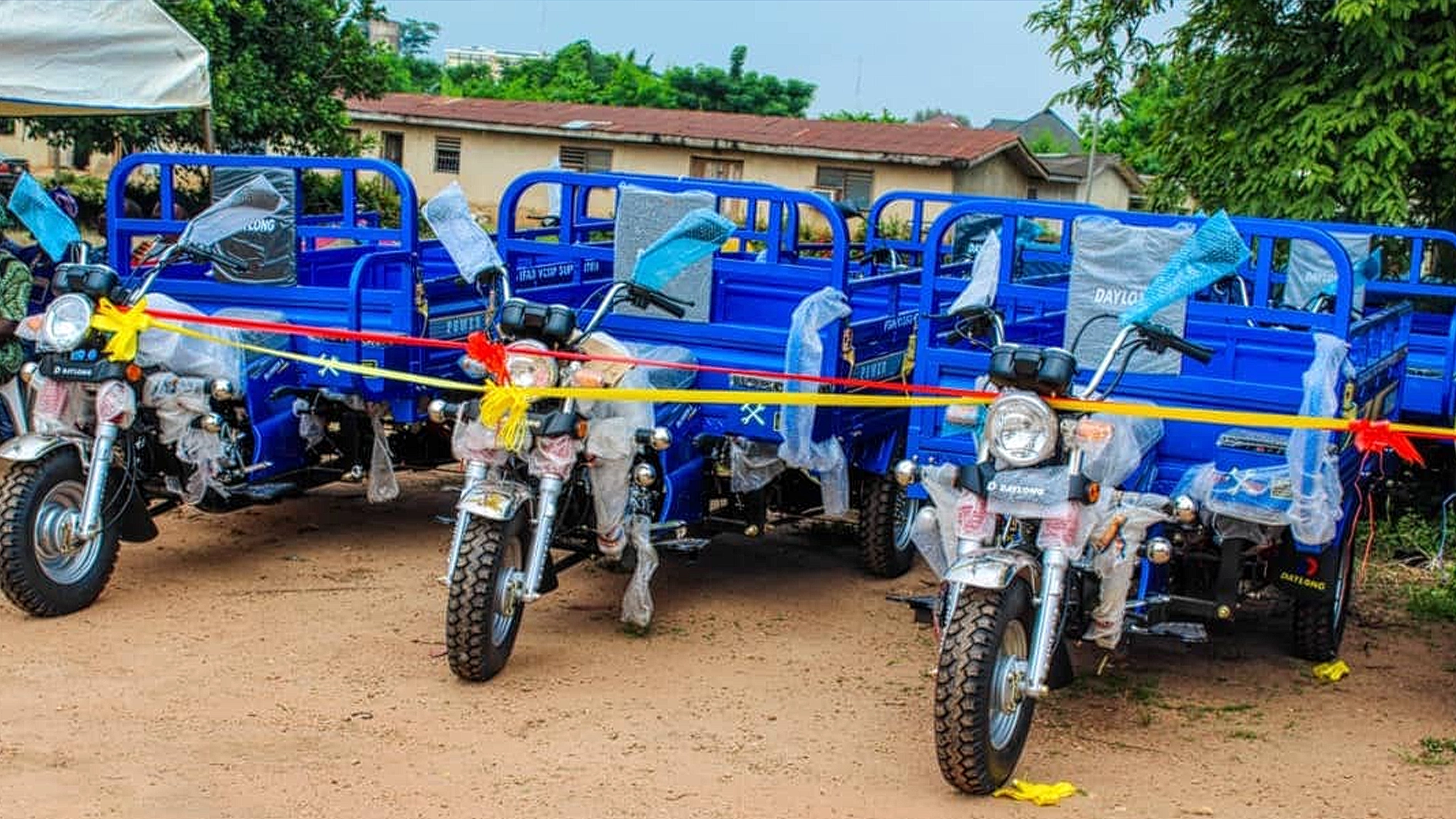 IFAD-VCDP hands Over 16 Tricycles to farmers
