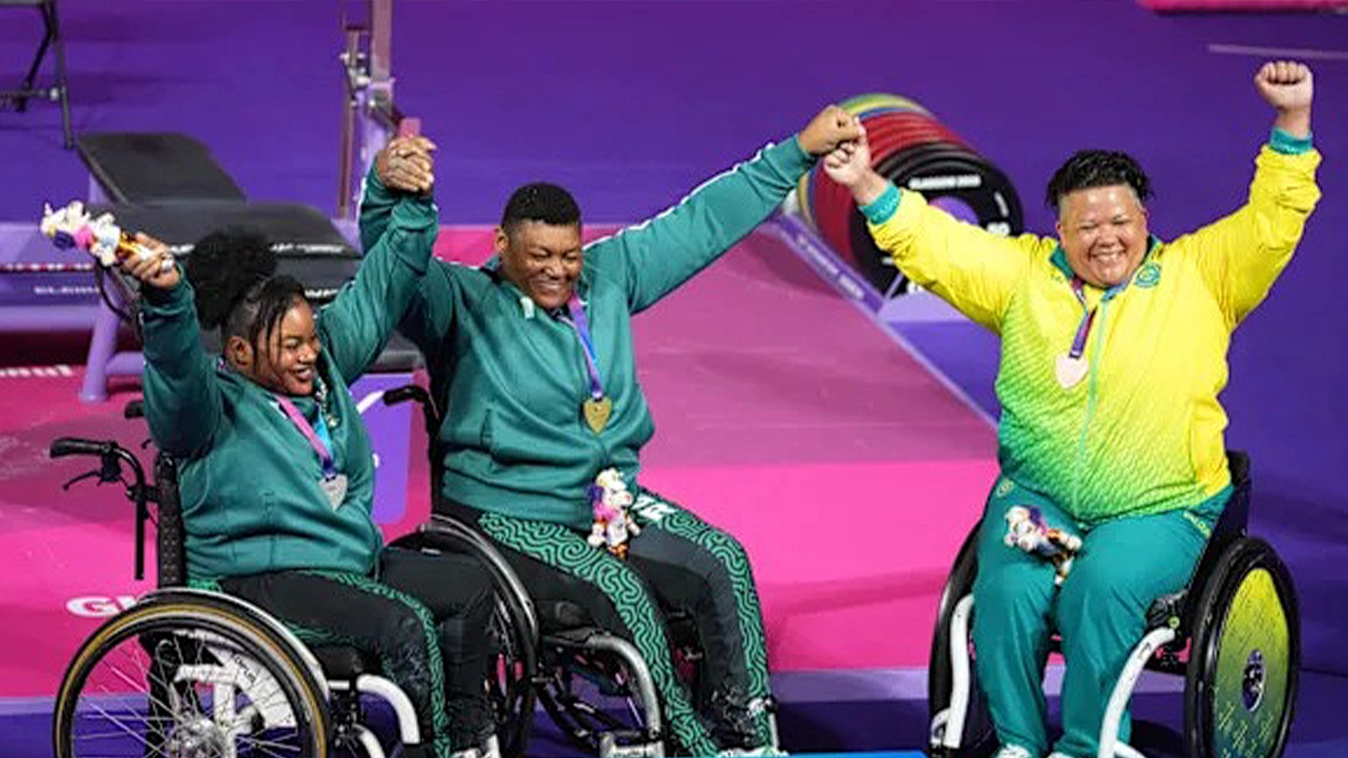 New World Record Oluwafemiayo Folashade and Rita Ferdinard receive their medals on Friday in Glasgow