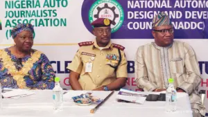 Deputy Director/Head of Public Relations, National Automotive Design and Development Council (NADDC), Susan Bisong Taiwo (left); Corps Marshal and Chief Executive of the Federal Road Safety Corps (FRSC), Shehu Mohammed; Deputy Managing Director of CFAO Motors Nigeria Limited, Kunle Jaiyesimi at the third Nigeria Auto Industry Summit (NAISU) in Lagos, yesterday.