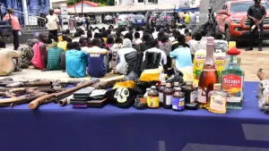 Arrested suspects with exhibits.