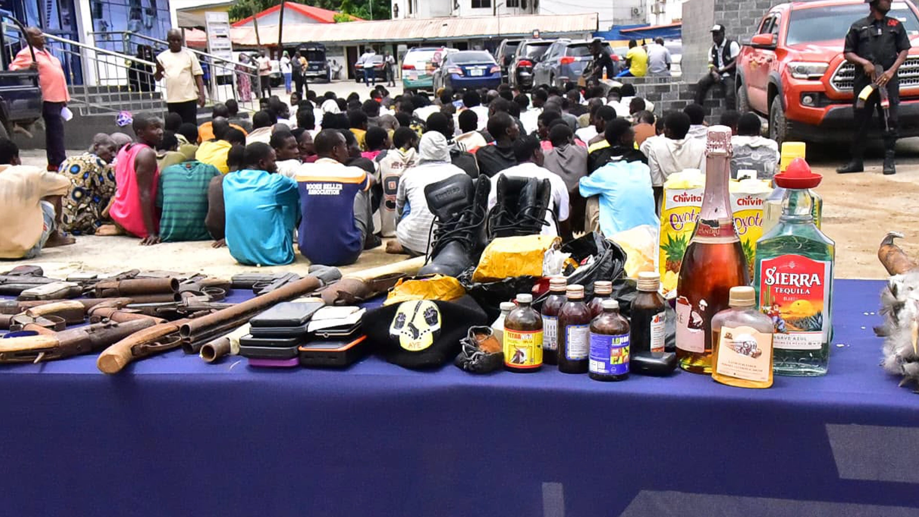 Arrested suspects with exhibits.