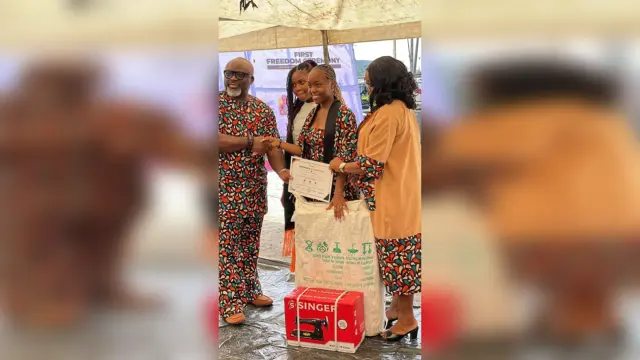 One of the trainees receives her certificate from the foundation