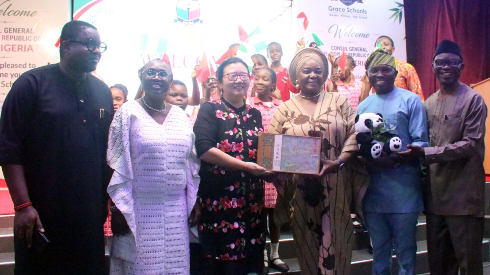 Chairman, Parent Teachers Association, Grace Children School, Mr Omoruyi Edoigiawerie; Head of School, Grace Children School, Dr Nike Akindayo; Consul General, Chinese Embassy, Lagos, Ms Yan Yuqinq; CEO, Grace Schools, Mrs Olatokunbo Edun; Head of Chinese Unit, Dept of Lingustics, African and Asian Studies, University of Lagos, Dr Adetoro Banjo and Deputy Head of School, Grace Children School,Mr Paul Ibe with Grace Schools students during the visit of the Consul General to the school in Gbagada, Lagos.