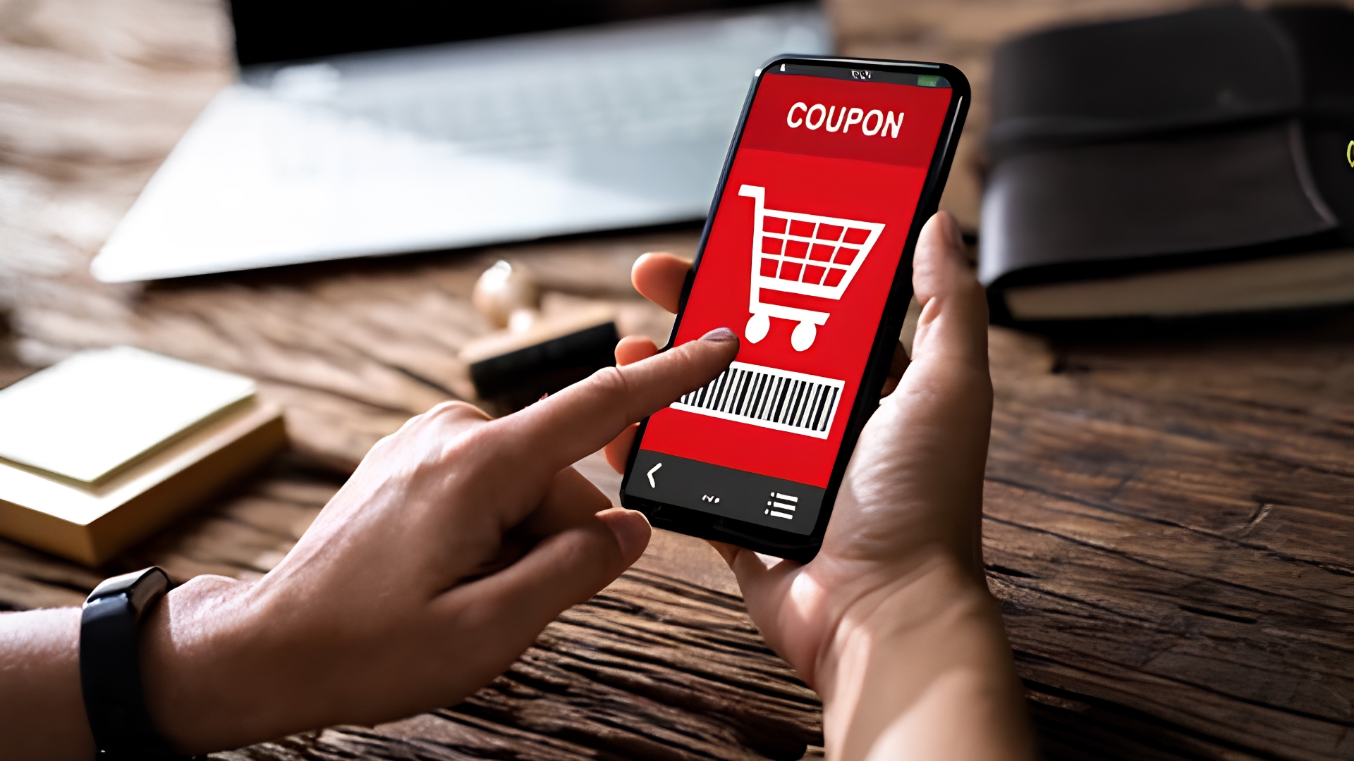 womans-hand-holding-mobile-phone-coupon
