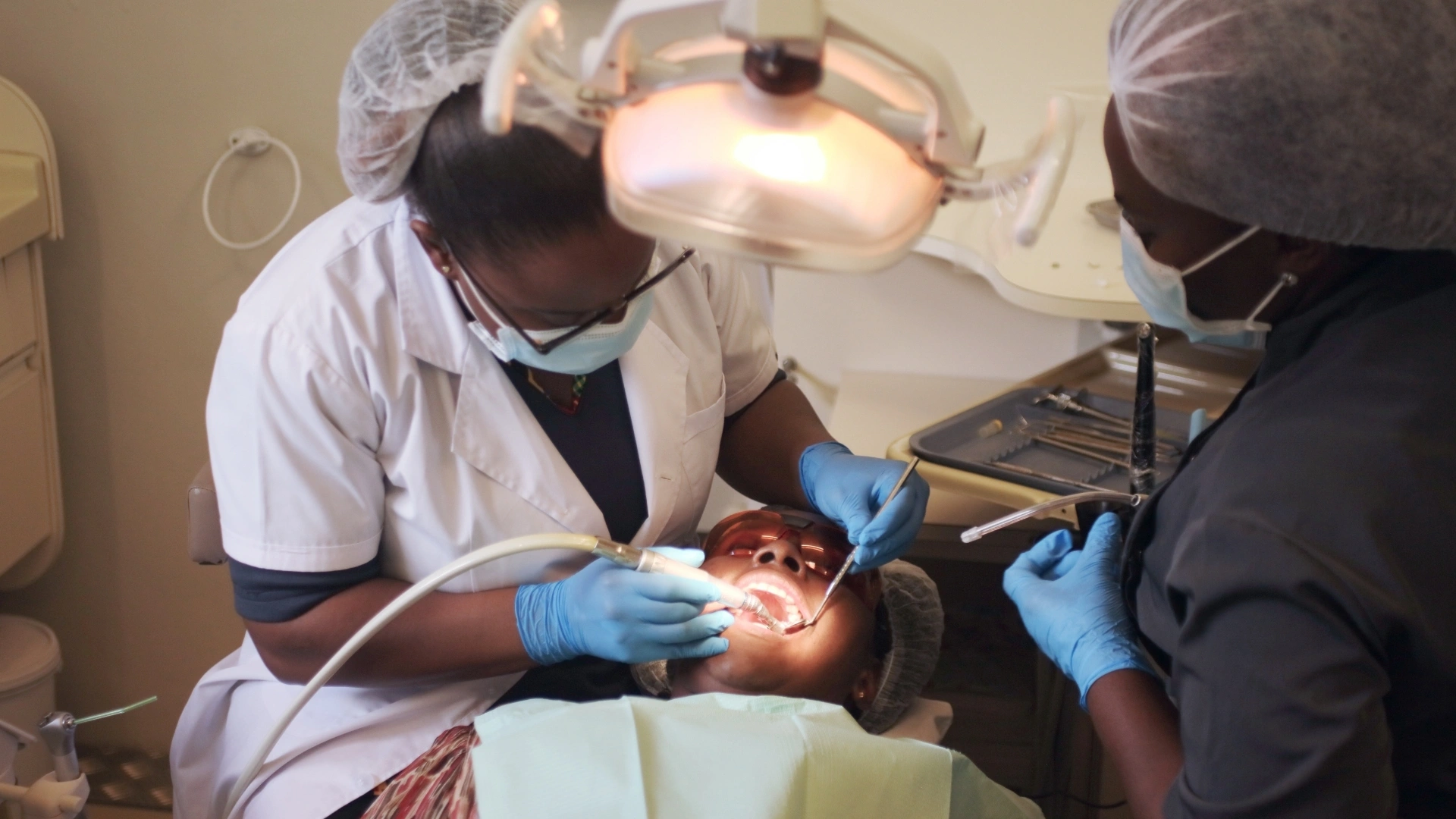 Dentist conducting a routine oral health examination on a patient