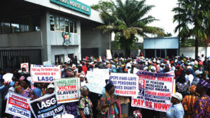 Pensioners under the Nigeria Union of Pensioners (NUP) Contributory Pension Scheme staged a peaceful protest to demand the implementation of a pension raise and wage awards, as well as the payment of outstanding arrears, but were met with tear gas from a police officer, leading to chaos and injuries among the elderly citizens at the State House, Ikeja, Lagos, yesterday.			               PHOTO: AYODELE ADENIRAN